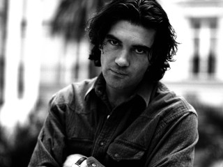 Man longhair leaning railing portrait - alexis grimou free wallpaper