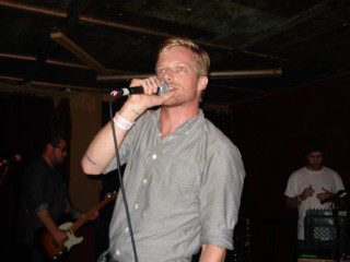 Man singing microphone guitar player - fructose free wallpaper