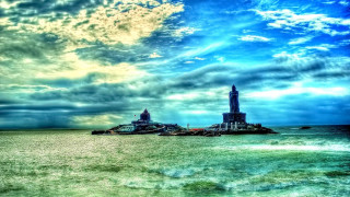 Large body of water lighthouse - cinematic landscape free wallpaper