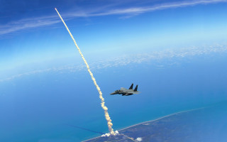 Jet rocket flying ocean sky - epic composition free wallpaper