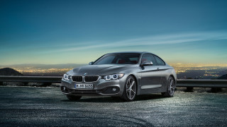 Silver car parked city skyline - constant permeke free wallpaper for desktop