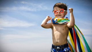 Young boy sunglasses towel beach - a young boy free wallpaper