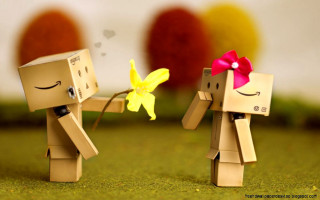 Paper people holding flower red - a yellow flower free wallpaper