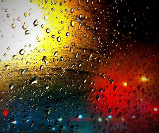 Rain covered window rainbow light - a rainbow free wallpaper