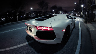 White sports car night parked - its light free wallpaper