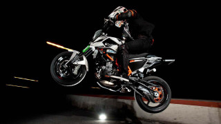Motorcycle trick air light black - the ground behind them free wallpaper