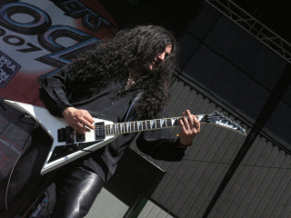 Man long hair guitar stage 9 - free dark wallpaper for desktop