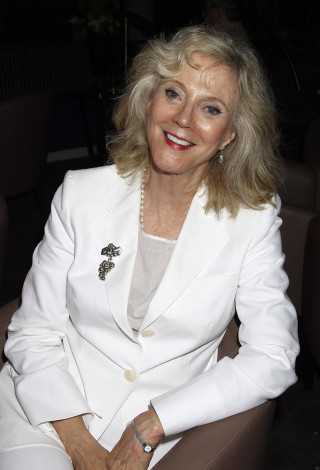 Woman white suit chair smiling - arthouse free wallpaper