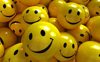 Yellow balloons smiley faces pile 2 - together free wallpaper