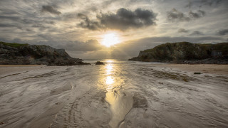 Sandy beach sunset rock outcropping - the background and a rock free wallpaper