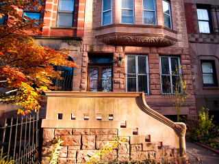 Large brick building gate clock - arthouse free wallpaper