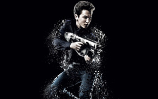 Man holding gun water splashing - a black background behind free wallpaper