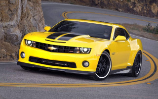 Yellow car winding road rock - winding free wallpaper