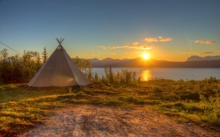 Teepee grass field lake sunset - the sun setting free wallpaper