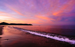 Beach wave sunset mountain distance - a mountain in the distance free wallpaper