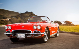 Red classic car grassy hill - classic free wallpaper