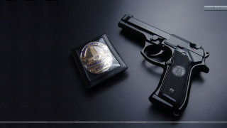 Gun badge table black background - silver free wallpaper