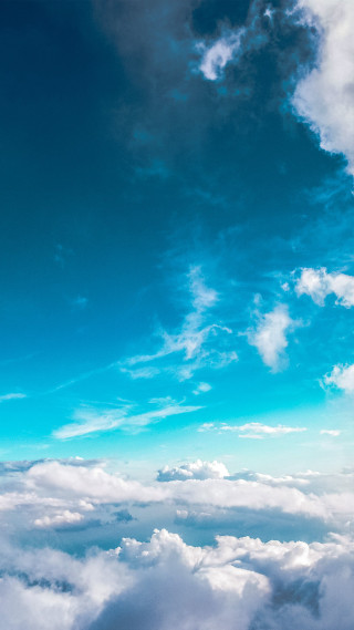 Plane flying high above clouds - free sky wallpaper for mobile