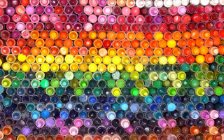 Rainbow colored glass bottles arranged - macro art free wallpaper
