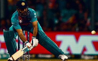 Man blue uniform playing cricket - text free wallpaper