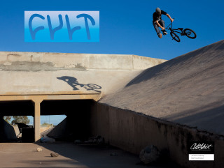 Man flying bike cement tunnel - graffiti free wallpaper