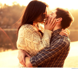 Man woman kissing sunset lake - free valentines wallpaper for tablet