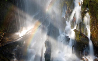 Waterfall rainbow man standing water - the water below free wallpaper