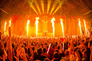 Crowd concert hands torches air - explosion free wallpaper