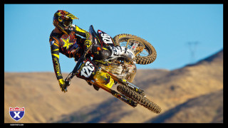 Motorcycle trick air hillside mountains - dusty free wallpaper