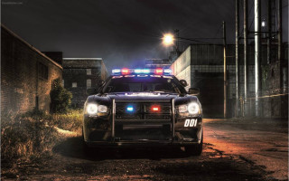 Police car dirt road night - a police car free wallpaper