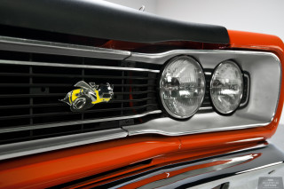 Car grille yellow logo closeup - end free wallpaper