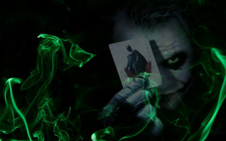 Joker holding card green smoke 2 - a card free wallpaper