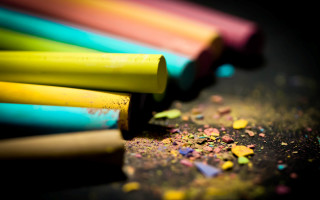 Colored pencils table black surface - free neon wallpaper for desktop
