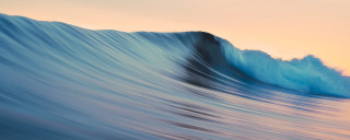 Large wave breaking ocean sunset - a large wave free wallpaper