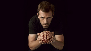 Man holding brain black background 3 - a black background behind free wallpaper