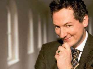 Man suit tie smiling hand - his chin free wallpaper