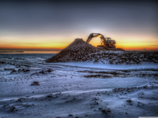 Dirt pile snow field ocean - a tractor free wallpaper