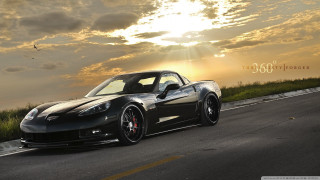 Black sports car cloudy sky 11 - a road under a cloudy sky free wallpaper