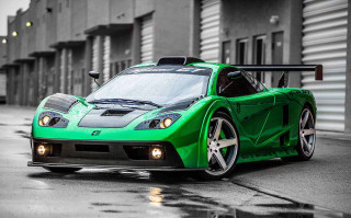 Green sports car parked street - a green sports car free wallpaper