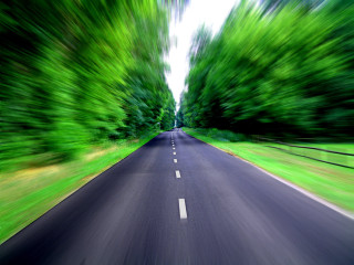 Blurry road trees fence side - motion blur free wallpaper