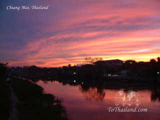 Sunset river clouds person bank - a sunset over a river free wallpaper