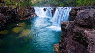 Waterfall blue pool forest trees - a blue pool in the middle of it free wallpaper