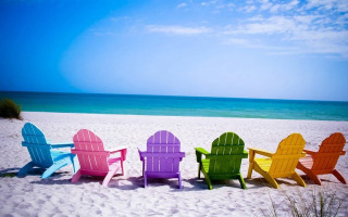 Colorful chairs sandy beach ocean 2 - a sandy beach next free wallpaper