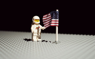 Lego man holding flag lego - tilt shift free wallpaper