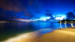 Beach water clouds night lights - a beach free wallpaper