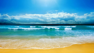 Beach waves sand blue sky 2 - a sunbeam in the distance free wallpaper
