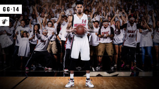 Man holding basketball crowd people 2 - a basketball in front free wallpaper