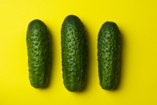 Three cucumbers yellow surface water - a yellow surface free wallpaper
