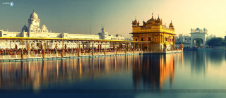 Large waterbuilding clocktower sunset cityscape - divinity free wallpaper for desktop