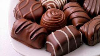 Plate of chocolates with white - a tablecloth free wallpaper